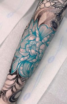 an arm with flowers and leaves on it