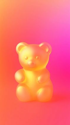 a yellow teddy bear sitting in front of a pink and orange background with the light reflecting off it's body