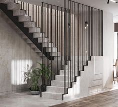 a stair case next to a potted plant in a living room