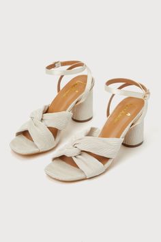 The Lulus Doroknot Champagne Knotted Pleated High Heel Sandals will make the perfect addition to any bridesmaid or best dressed guest 'fit! These eye-catching heels are feature a pleated fabric composition that shapes an almond-shaped toe bed and a trendy knotted vamp that creates an open-toe upper. Slender straps sprout from the sides to wrap and secure around the ankle with a gold buckle, all atop a chunky block heel. 3" wrapped block heel. Lightly cushioned insole. Felted rubber sole has nons Chic Summer Wedding Guest Shoes, Summer Sandals With Padded Heel For Wedding Guest, Summer Wedding Guest Sandals With Block Heel, Low Heel Summer Wedding Guest Heels, Low Heel Heels For Wedding Guest In Summer, Low Heel Wedding Guest Heels For Summer, Summer Wedding Guest Shoes With Block Heel, Summer Wedding Guest Low Heel Shoes, Summer Wedding Guest Low Heels