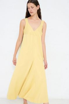 Slip dress made from a fluid viscose crepe. Features thick straps, a deep v-neckline and an asymmetric pleat at front. Color: Butter (Yellow) Material: 83% Viscose, 17% Virgin Wool Regular fit Natalie is 5'10" and wears a UK10. Sleeveless Silk V-neck Dress For Summer, Silk V-neck Summer Dress, Spring A-line Midi Dress With Bias Cut, Chic V-neck Viscose Dress For Summer, Summer A-line Bias Cut Slip Dress, Silk V-neck Slip Dress For Summer, Summer Silk V-neck Slip Dress, V-neck Bias Cut Dress For Daywear, Yellow Bias Cut Dress For Summer