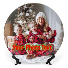 a glass plate with an image of two children and a christmas tree in the background