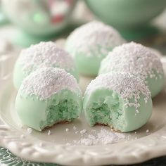 some green and white desserts on a plate