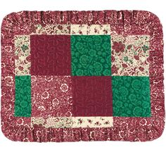 a red and green patchwork quilted placemat