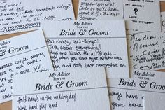 wedding programs are laid out on top of each other for guests to sign in the ceremony