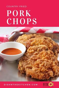 fried pork chops on a plate with dipping sauce