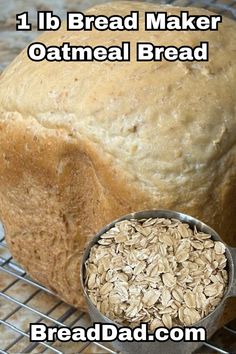 a loaf of oatmeal bread sitting on top of a metal cooling rack