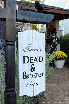 a wooden sign that says james dead and breakfast inn on the side of a house