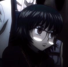 an anime character with black hair and big eyes looking at something in front of her