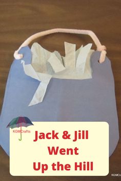 a paper bag with an umbrella on it and the words jack & jill went up the hill