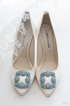 white wedding shoes with blue beading on them