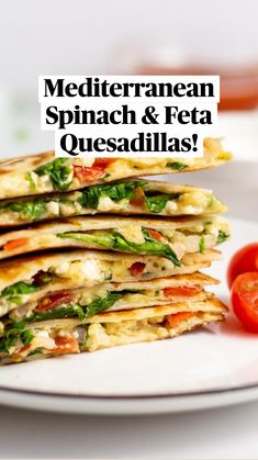 a stack of quesadillas with tomatoes on the side