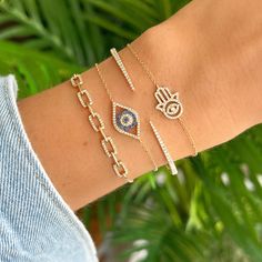 14K Gold Diamond Evil Eye Hamsa Bracelet. Hamsa symbolize good fortune, health and happiness. This cute bracelet shine on its own or stacked with different styles. Item Information: Metal: 14k Gold Weight: 1.7g Chain Length: 6" + 1" Extender Dimensions: 10.25x13.75mm Diamond Information: No. of Diamonds: 72 Total Carat Weight: 0.16 Turquoise Heart Necklace, Evil Eye Hamsa, Pave Diamond Earrings, Hamsa Bracelet, Diamond Evil Eye, Turquoise Heart, Mother Of Pearl Necklace, Small Charms, Diamond Star