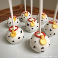 some cake pops with dalmatian designs on them