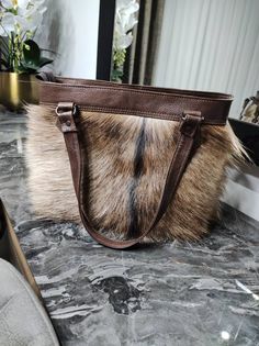 -Natural handmade goatskin bag, 35.cm.25 cm. 1.3 ft.0.8ft.  -Completely natural, real and odorless. Colors.  -Express shipping.color. Brown  Thanks for visiting our shop. Hope we can help you find perfect decoration. All of our sheepskins are real, natural, odorless and soft. They are all selected and processed carefully. Luxury Sheepskin Shoulder Bag For Everyday, Brown Double Handle Shoulder Bag Gift, Classic Leather Tote, Fur Bag, Student Bag, Clothes Crafts, Personalized Leather, Classic Leather, Gift Christmas