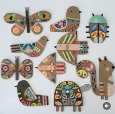 a group of wooden cut outs with different designs and shapes on them, including birds