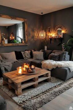 a living room filled with lots of furniture and candles on top of a coffee table