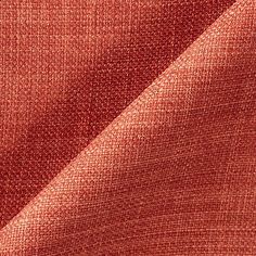 an orange fabric textured with small dots on the outside, as well as some other material