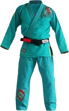 a person wearing a blue karate suit with red belt and green pants, standing in front of a white background