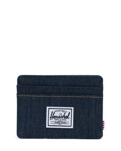 the charlie wallet is a compact card holder made for daily journeys. card carrier is perfect to carry in your pocket or toss into your bag. available in thirteen styles: black, black crosshatch, cafe creme, harvest gold, indigo denim, ivy green, navy, peacoat, port, raven crosshatch, rubber, shadow floral, and sunflower field 3" h x 4" w signature herschel striped liner RFID blocking layer multiple card slots storage sleeve Denim Card Holder, Leather Card Holder With Flat Pocket For Everyday Use, Leather Card Holder With Zipper Pocket, Blue Card Holder With Card Slots, Modern Blue Wallet With Card Slots, Slim Denim, Herschel, Denim Bag, Daily Workout