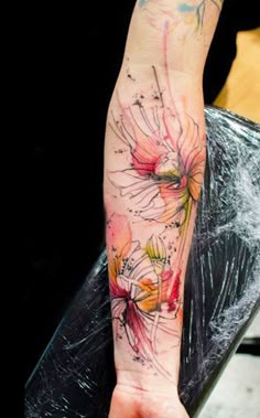 a woman's arm with flowers on it and the words, klaim