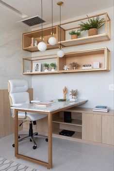 a home office with shelving and shelves on the wall, along with a white chair