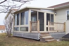 a house with a porch and screened patio