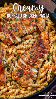 creamy buffalo chicken pasta in a cast iron skillet