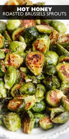 roasted brussel sprouts on a white plate with text overlay that reads, hot honey roasted brussel sprouts