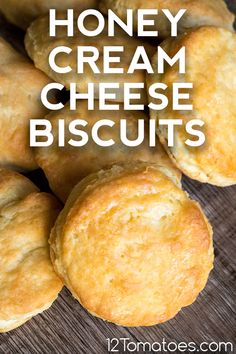 honey cream cheese biscuits on a wooden table with text overlay that reads, honey cream cheese biscuits