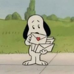 a cartoon dog holding an envelope in its paws and looking at it's face