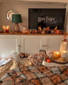 a harry potter themed bedroom with pumpkins and candles