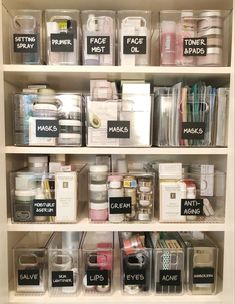 an organized pantry with clear plastic containers and labels on the shelves, labeled with words