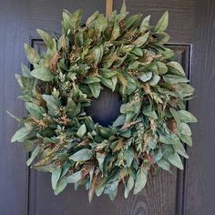 a wreath is hanging on the front door