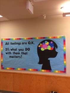 a bulletin board with an image of a woman's head and words on it