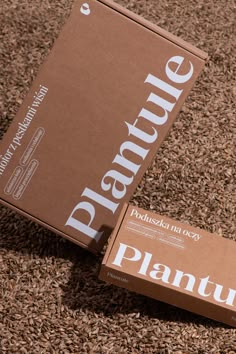 a box of planturine sitting on the ground next to it's packaging