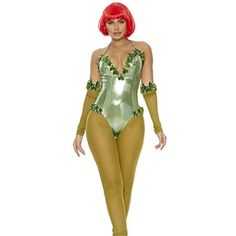 a woman in a green and gold bodysuit is posing for the camera with her hands on her hips