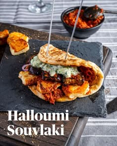 Halloumi Souvlaki on a slate Soft Flatbread, Tomato Tapenade, Greek Flatbread, Roasted Aubergine, Souvlaki Recipe, Grilled Halloumi, Tzatziki Sauce, Greek Dishes