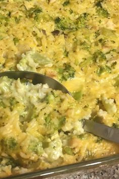 a casserole dish with broccoli and cheese on it, ready to be eaten