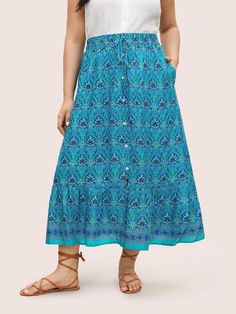 Casual Tiered Skirt With Button Closure, Casual Tiered Skirt With Buttons, Casual Beach Skirt With Button Closure, Casual Button Skirt For Vacation, Casual Flowy Turquoise Skirt, Blue Button-up Summer Skirt, Blue Button-up Casual Skirt, Blue Midi Skirt With Button Closure, Indigo Pattern