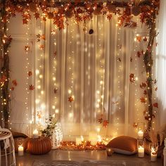 the room is decorated with fall leaves and candles