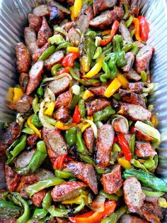 a pan filled with meat and vegetables on top of a table