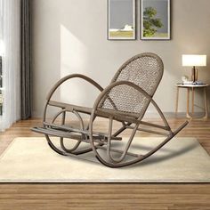 a rocking chair sitting on top of a wooden floor next to a white rug in front of a window