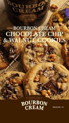 bourbon cream chocolate chip and walnut cookies on a cooling rack next to a bottle of bourbon cream