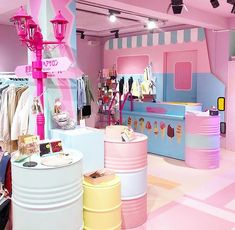 an ice cream shop with pastel colors and lots of stuff on display in the store