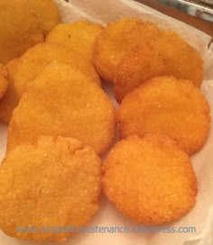 some fried food is sitting in a paper bag