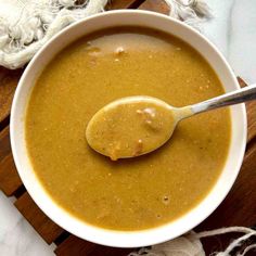 a bowl of soup with a spoon in it