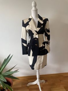 Moschino iconic 90s suit. Size XS, 70% cotton, 30% rayon. Blazer measurements: Chest 90cm, shoulders 40cm , length 66cm Skirt measurements: Waist 68cm, length 53cm Very good condition. Retro Fitted Cotton Sets, Fitted Cotton Retro Blazer, Retro Fitted Cotton Blazer, Spring Fitted Blazer With Graphic Print, Moschino 90s, Moschino Cheap And Chic 90s, Vintage Fitted Skirt Suit With Notch Lapel, Luxury Vintage Fitted Skirt Suit, Moschino Vintage 1990s