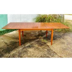 Mid-Century Danish Teak Extendable Dining Table   This table has to be one of my favorites to date! From our private collection, this table has true mid-century charm. A tapered rectangle with rounded edges and beveled veneer work around the perimeter. There are two stowaway butterfly-style leafs that can be stowed below the tabletop. Each leaf opens on a hinge and butterflies open with ease.   Truly meant for a feast, this table extends to 103" long!  Made in Demark stamp found below. Mix of so Butterfly Table, Butterfly Style, Walnut Dining Table, Mid Century Danish, Century Furniture, Extendable Dining Table, Mid Century Furniture, Apartment Ideas, My Favorites