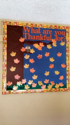 a bulletin board that says what are you grateful for? with leaves on the front